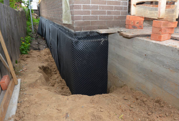 Happy homeowners after waterproofing job in Cabin John